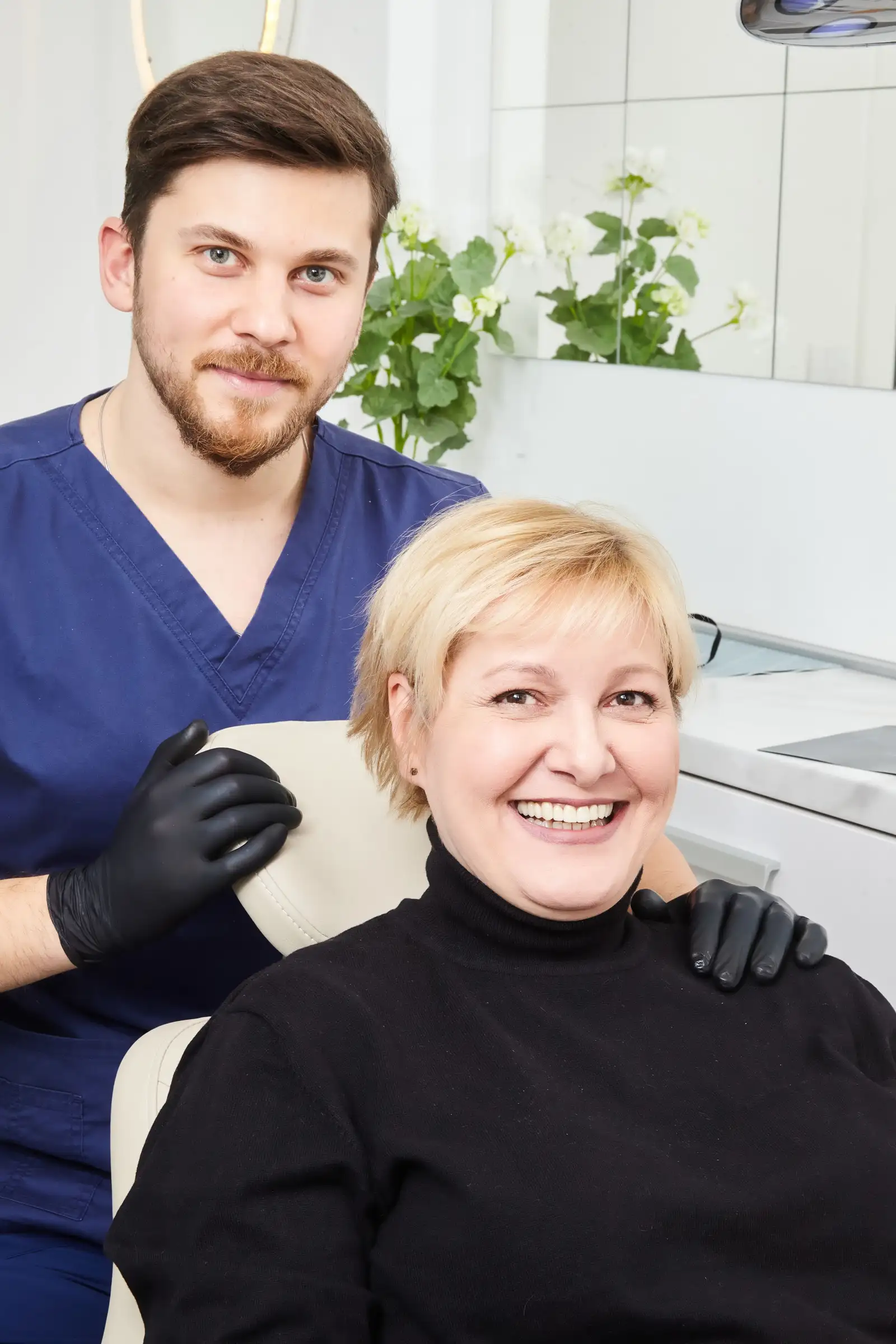 A friendly dentist with a patient at Harbor Dental